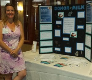Emily Nichols, IBCLC, with donor milk educational lobby display