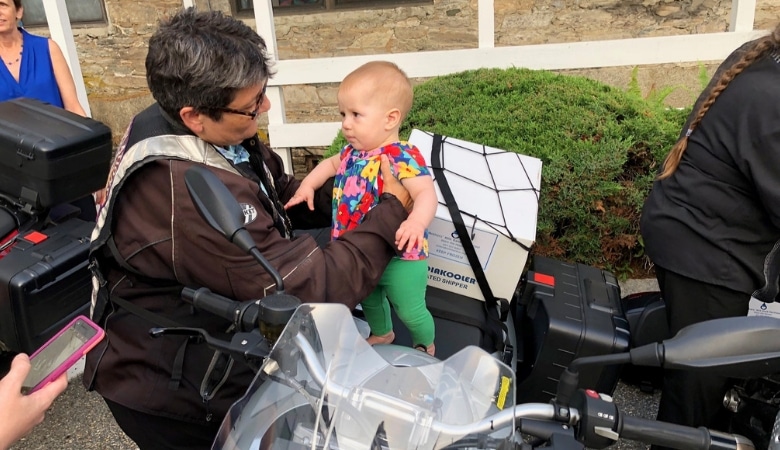 Motorcycle group member with baby
