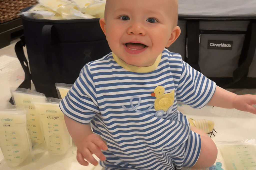 Baby smiles as he helps mom pack up milk 