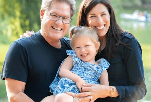 Photo of a smiling preemie mom and her now five year old daughter